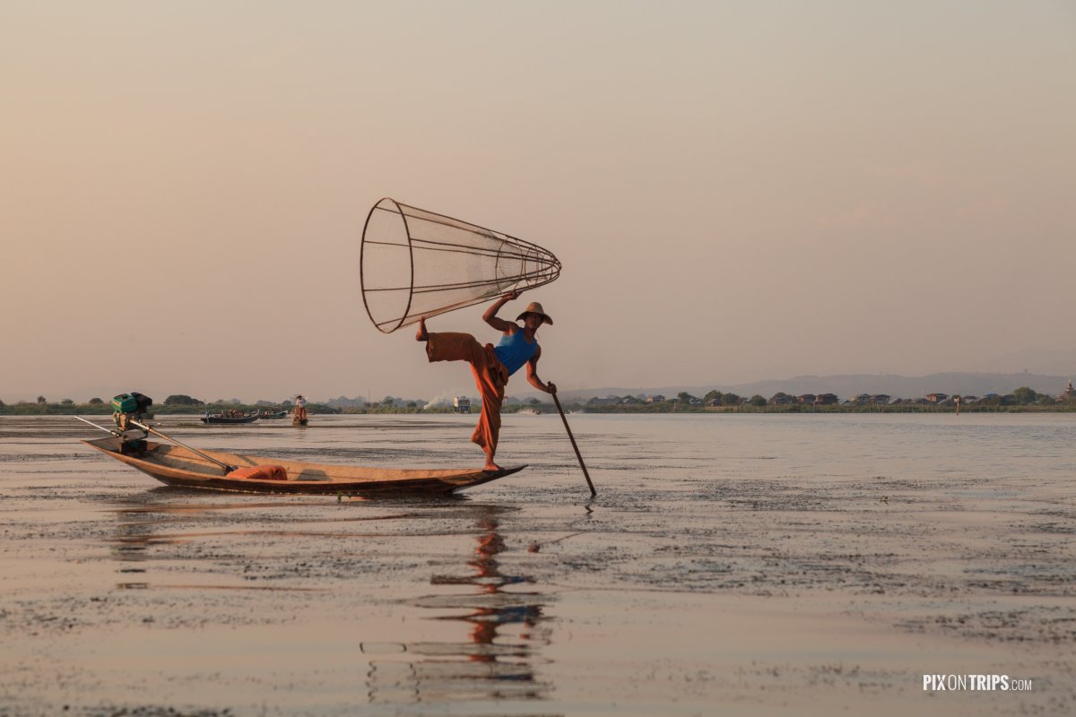 Intha fisherman posing with conical net, Lake Inle, Myanmar - Pix on Trips