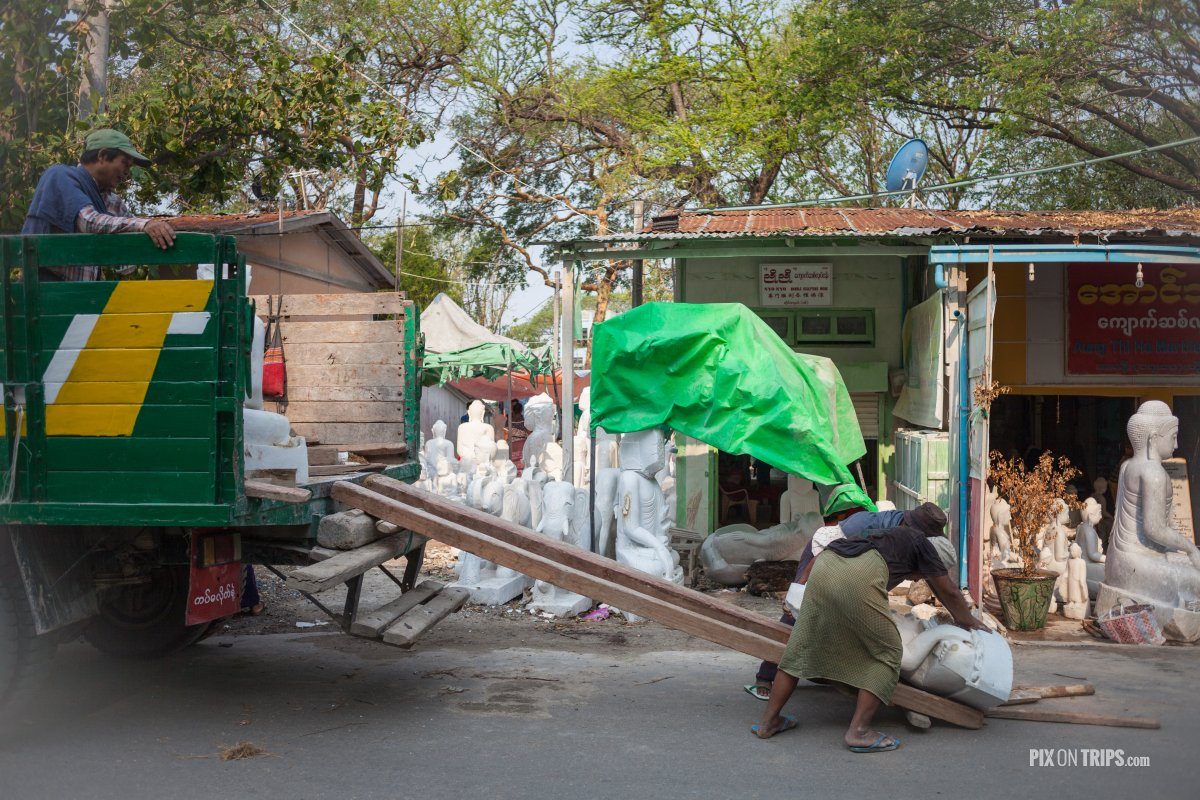 Men load sculptures for export, Mandalay, Myanmar