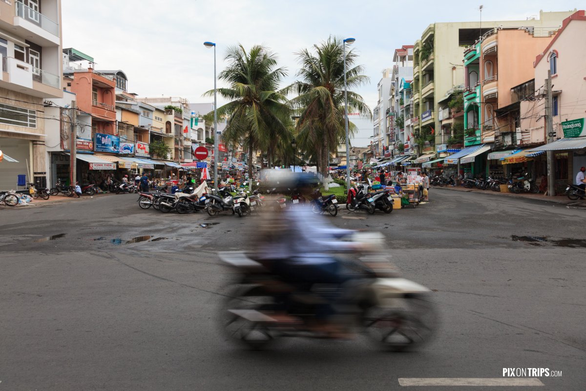 Motorbike driving by street, Can Tho, Vietnam - Pix on Trips