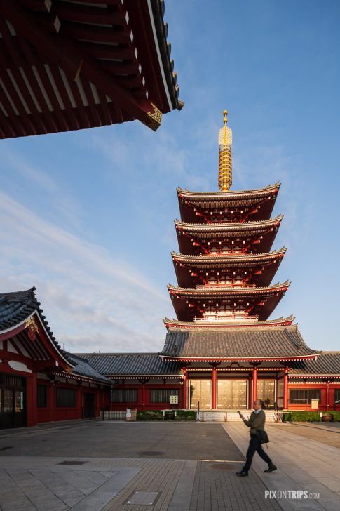 Man passes by the Five-Story Pagoda at Sensoji, Asakusa, Tokyo, Japan - Pix on Trips